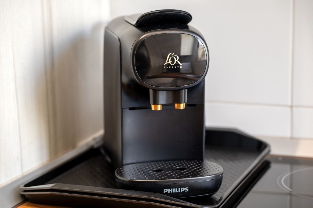 Modern coffee machine above a table