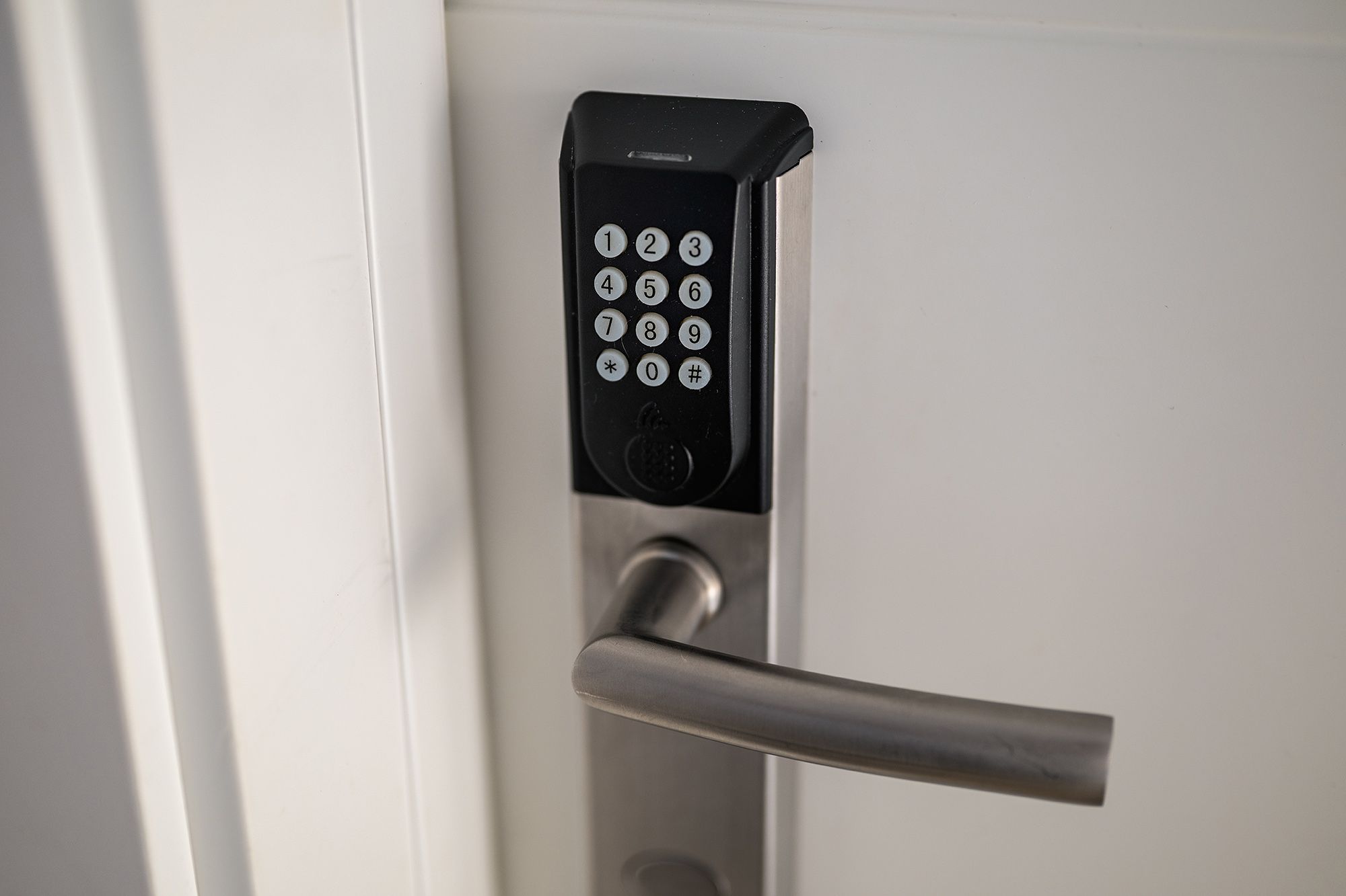 Digital keypad on a door handle for keycode access check-in.
