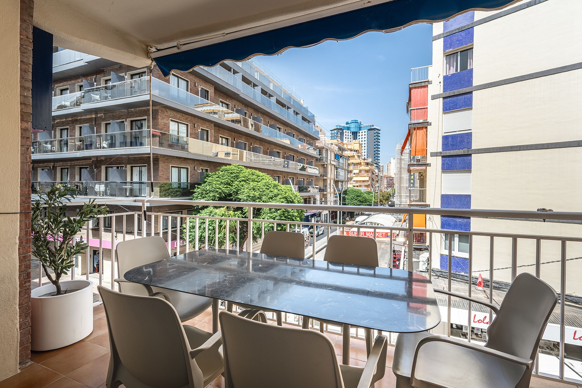 Beachside apartment in Spain featuring a terrace balcony with a view of Benidorm's coastline