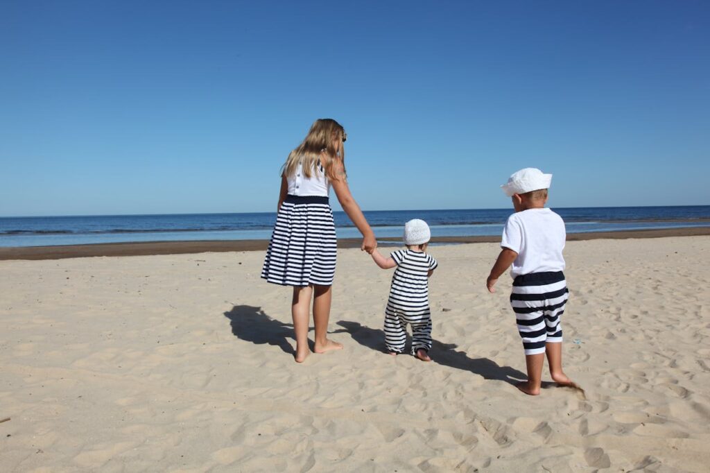 Kids walk freely by the beach in a family-friendly vacation