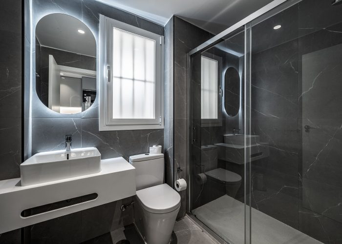 Bright modern apartment with an open kitchen and a welcoming dining area.